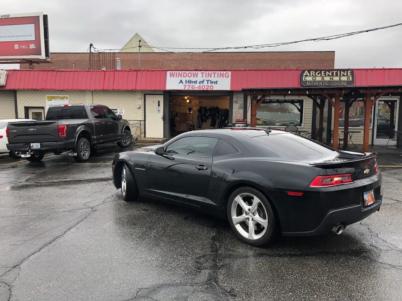 Black Chevrolet Camaro with tinted windows