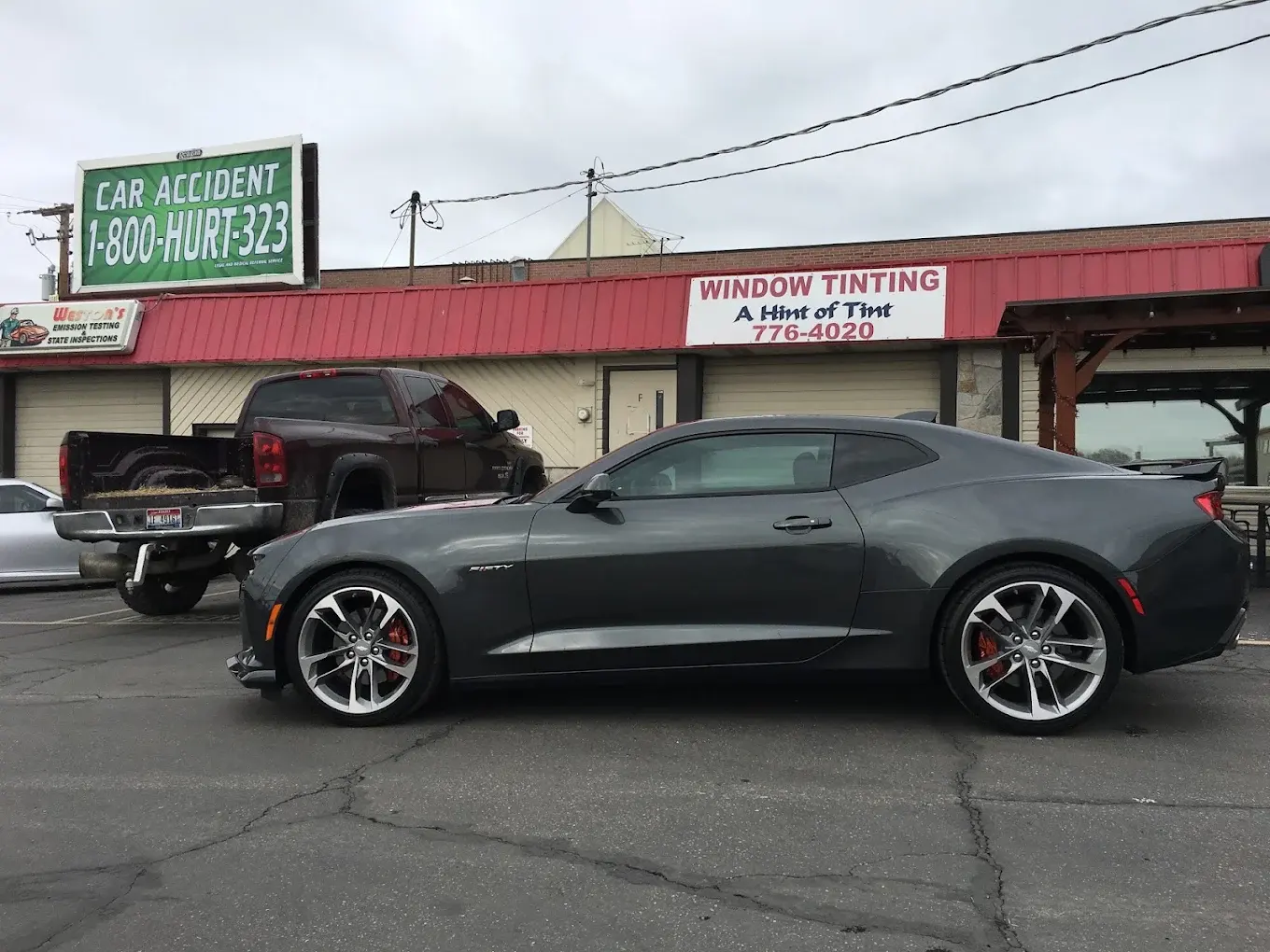 Gray Chevrolet Camaro with tinted windows