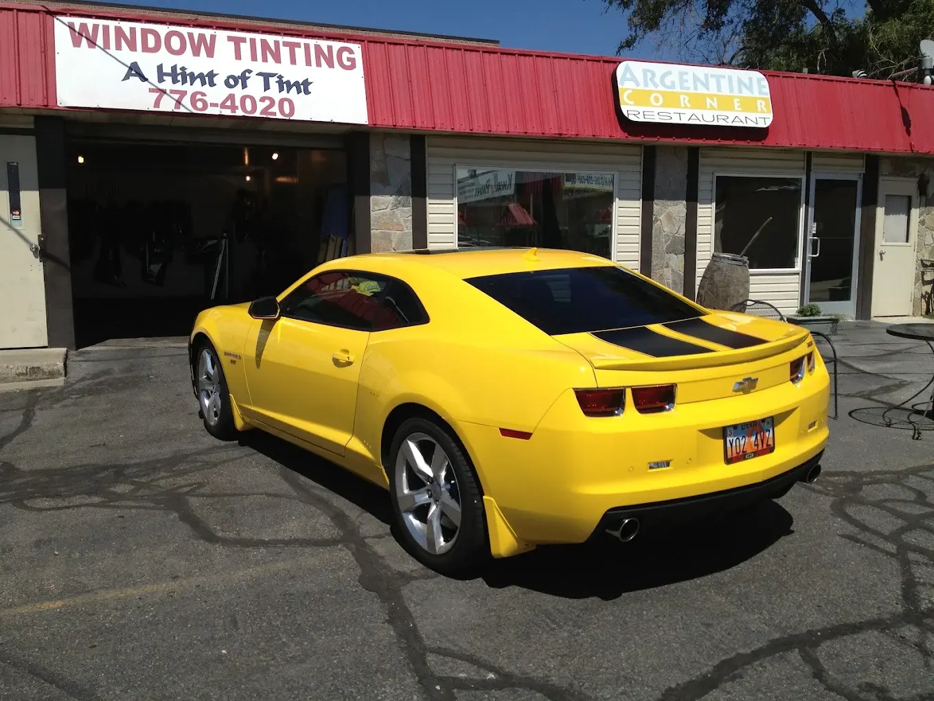 Yellow Chevrolet Camaro with tinted windows
