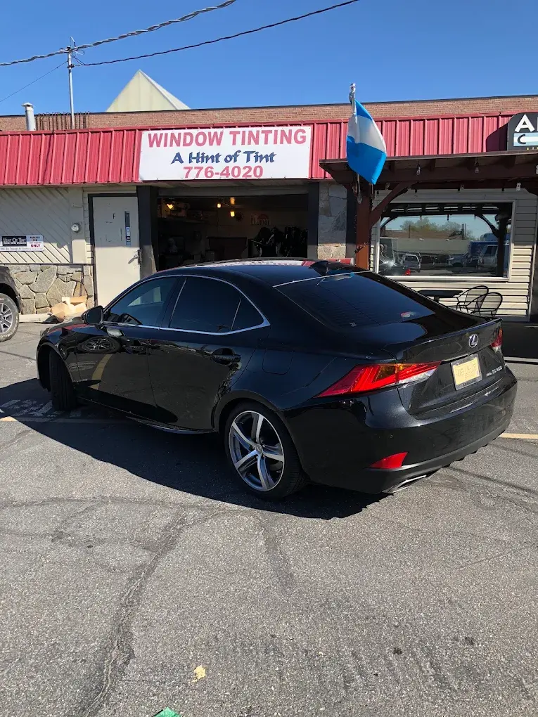 Black Lexus IS with tinted windows