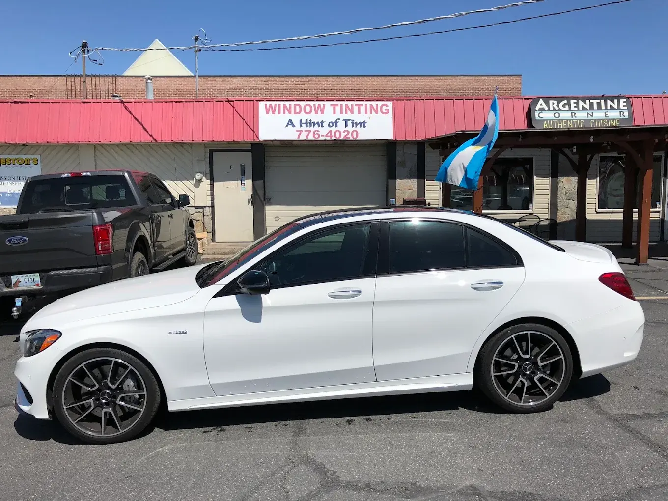 White Mercedes-Benz C43 AMG with professionally tinted windows