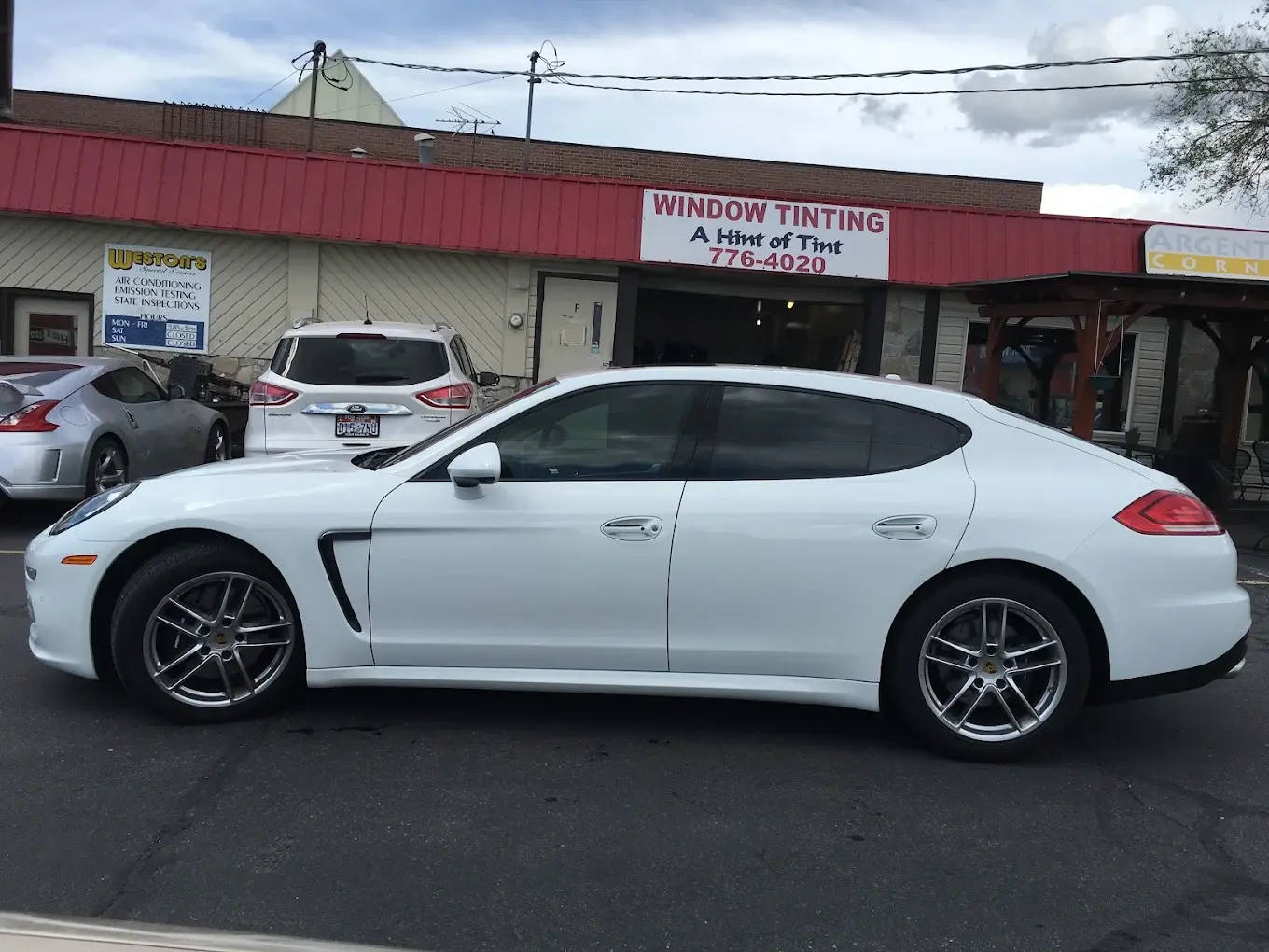White Porsche Panamera with tinted windows