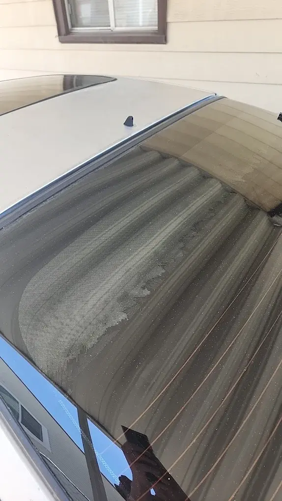 Close-up of freshly applied rear-window tint film