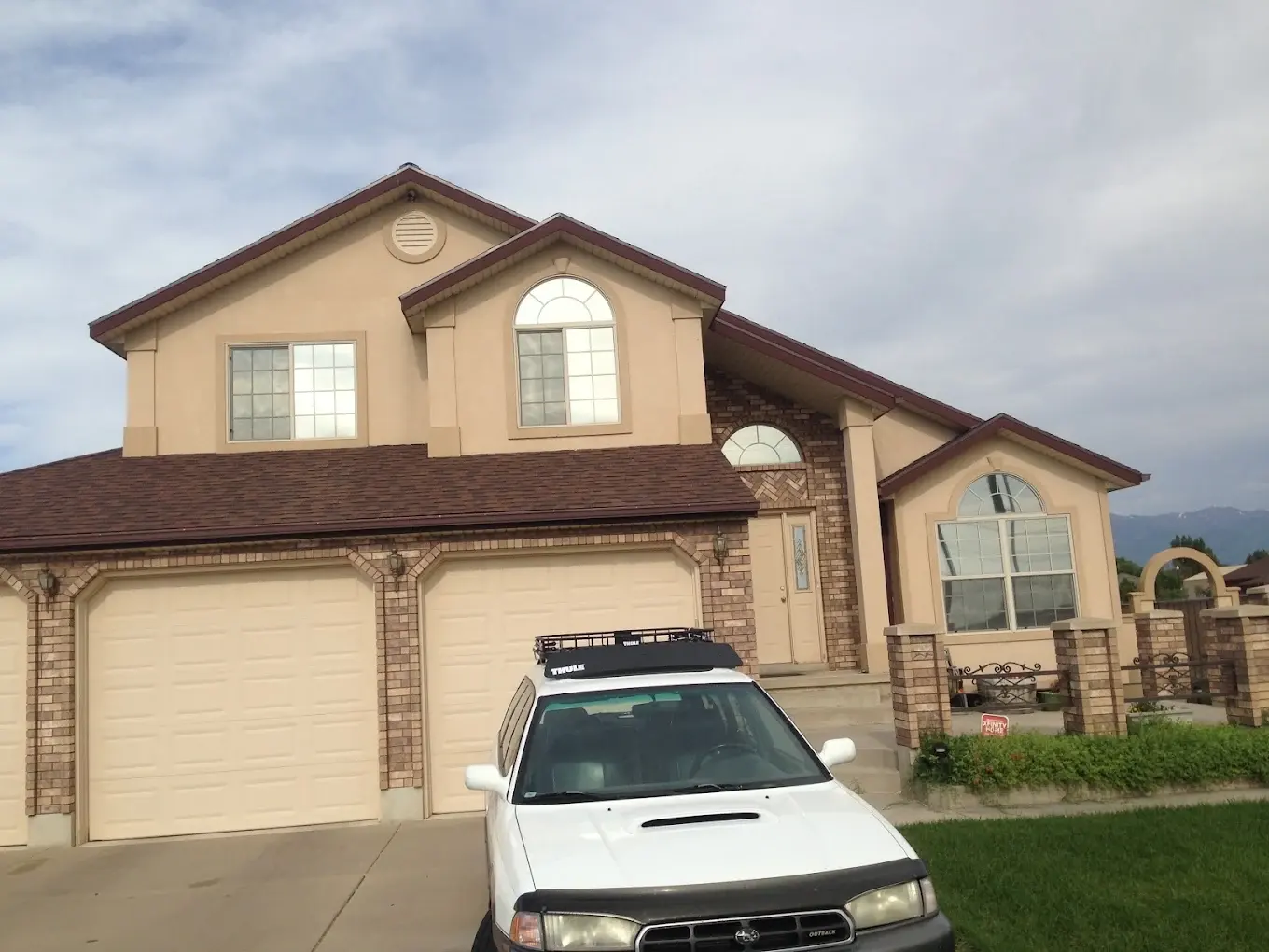 Two-story home with tinted windows